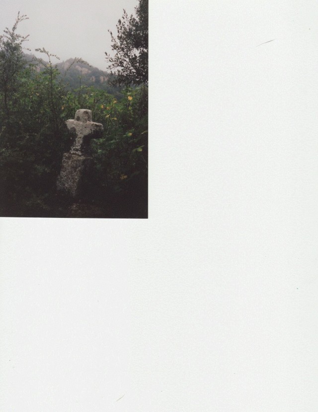 Small stone cross along the trail in Basque France.